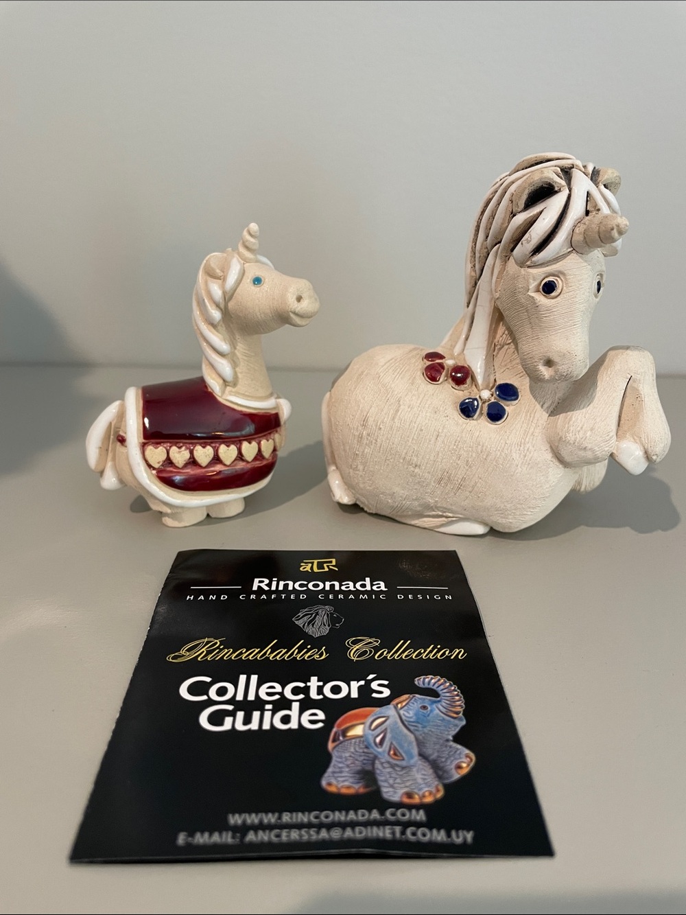 Rinconada Ceramic Unicorn Pair in Cream and Burgundy